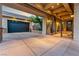 Elegant home featuring a porte cochere with decorative ironwork leading to a landscaped entryway and attached two-car garage at 2870 Quartz Canyon Dr, Henderson, NV 89052