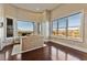 Bright sitting area with floor-to-ceiling windows offering an amazing view of the desert landscape at 2870 Quartz Canyon Dr, Henderson, NV 89052
