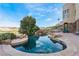 Beautiful swimming pool features rock details and a spa, creating a tranquil outdoor oasis at 2870 Quartz Canyon Dr, Henderson, NV 89052
