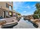 Resort-style swimming pool with rock features and lush landscaping, perfect for relaxation and entertainment at 2870 Quartz Canyon Dr, Henderson, NV 89052