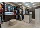 This walk-in closet is complete with custom cabinets and center ottoman at 2870 Quartz Canyon Dr, Henderson, NV 89052
