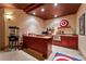 Basement wet bar with custom cabinets and unique decor at 2870 Quartz Canyon Dr, Henderson, NV 89052