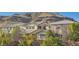 Luxury homes nestled in the foothills of a mountain range at 5873 Skyfall Ct, Las Vegas, NV 89135