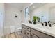Clean bathroom with dual sinks, white subway tile shower, and modern fixtures at 5873 Skyfall Ct, Las Vegas, NV 89135
