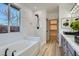 The Bathroom boasts dual sinks, soaking tub, and white subway tiles at 5873 Skyfall Ct, Las Vegas, NV 89135