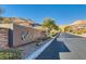 Modern community entrance sign with mountain views at 5873 Skyfall Ct, Las Vegas, NV 89135