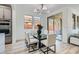 Elegant dining space has backyard views and is conveniently located near the living room at 5873 Skyfall Ct, Las Vegas, NV 89135