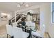 Dining area with easy access to kitchen and staircase, perfect for entertaining at 5873 Skyfall Ct, Las Vegas, NV 89135