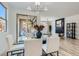 Dining room with view to living area with stylish furnishings and decor at 5873 Skyfall Ct, Las Vegas, NV 89135