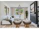 Cozy living room is bathed in natural light and features neutral tones and a modern fireplace at 5873 Skyfall Ct, Las Vegas, NV 89135