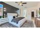 This bedroom features a wall design and two windows with natural lighting at 5873 Skyfall Ct, Las Vegas, NV 89135