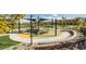 Community playground with shade structures and play equipment at 5873 Skyfall Ct, Las Vegas, NV 89135