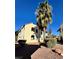 Exterior view of a two-story building with desert landscaping and mature trees at 6137 W Oakey Blvd # A, Las Vegas, NV 89146