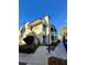 Exterior view of building with desert landscaping and blue awning accents at 6137 W Oakey Blvd # A, Las Vegas, NV 89146