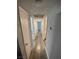 Hallway features gray wood-look floors and white doors to other rooms at 6137 W Oakey Blvd # A, Las Vegas, NV 89146