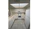 Bright kitchen featuring white appliances, cabinets, and a skylight at 6137 W Oakey Blvd # A, Las Vegas, NV 89146