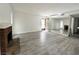 Bright living room featuring a brick fireplace and wood-look flooring at 6137 W Oakey Blvd # A, Las Vegas, NV 89146