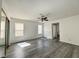 Spacious living room with ample natural light, ceiling fan and wood-look flooring at 6137 W Oakey Blvd # A, Las Vegas, NV 89146