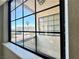 Window view shows courtyard with desert landscaping, palm trees, and blue skies at 6137 W Oakey Blvd # A, Las Vegas, NV 89146