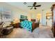 Primary bedroom featuring a ceiling fan and en-suite bathroom access at 6360 Bridal Cave Ave, Las Vegas, NV 89131