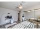 Well-lit bedroom with mirrored closet and home office at 7929 Diamond Rock Way # 101, Las Vegas, NV 89128