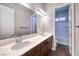 Bathroom vanity with double sinks and view of the shower at 8351 Agave Bloom St, Las Vegas, NV 89131