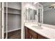 Bathroom featuring walk-in closet and marble-look vanity countertop at 8351 Agave Bloom St, Las Vegas, NV 89131