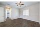 Spacious bedroom featuring wood-look floors and a ceiling fan, with ensuite access at 8351 Agave Bloom St, Las Vegas, NV 89131