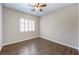 Bright bedroom with wood-look floors and window with shutters at 8351 Agave Bloom St, Las Vegas, NV 89131