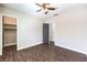 Bedroom featuring wood-look floors, ceiling fan, and closet at 8351 Agave Bloom St, Las Vegas, NV 89131