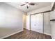 Bedroom featuring wood-look floors and a barn door closet at 8351 Agave Bloom St, Las Vegas, NV 89131