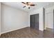 Bedroom with wood-look floors and closet with double doors at 8351 Agave Bloom St, Las Vegas, NV 89131
