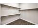 Walk-in closet with built-in shelving and hanging rods for organized storage at 8351 Agave Bloom St, Las Vegas, NV 89131