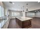 Well-appointed kitchen with granite counters, stainless appliances, and seamless flow into the living area at 8351 Agave Bloom St, Las Vegas, NV 89131