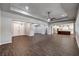 Large open living space with dark wood floors and neutral walls at 8351 Agave Bloom St, Las Vegas, NV 89131