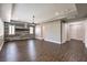 Expansive living room featuring wood floors and a ceiling fan and a view to other rooms at 8351 Agave Bloom St, Las Vegas, NV 89131