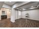 Spacious living room featuring wood-look flooring, recessed lighting, and decorative wood accents at 8351 Agave Bloom St, Las Vegas, NV 89131