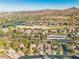 Aerial view showcasing 120 Emerald Dunes near golf course and lake at 120 Emerald Dunes Cir, Henderson, NV 89052