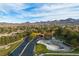 Aerial view showcasing community entrance and landscape at 120 Emerald Dunes Cir, Henderson, NV 89052