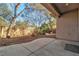 Spacious backyard with gravel landscaping and mature trees at 120 Emerald Dunes Cir, Henderson, NV 89052