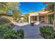 Spacious backyard with patio, fire pit, and built-in seating at 120 Emerald Dunes Cir, Henderson, NV 89052