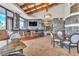 Modern bar with seating area and large screen TV at 120 Emerald Dunes Cir, Henderson, NV 89052
