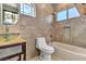 Modern bathroom with tile shower and soaking tub at 120 Emerald Dunes Cir, Henderson, NV 89052