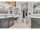 Double vanity bathroom with access to bedroom and additional bath area at 120 Emerald Dunes Cir, Henderson, NV 89052