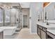 Elegant bathroom featuring a soaking tub, walk-in shower, and dual sinks at 120 Emerald Dunes Cir, Henderson, NV 89052