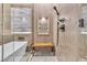 Bathroom with a walk-in shower, built-in shelving, and tiled walls at 120 Emerald Dunes Cir, Henderson, NV 89052