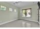 Spacious bedroom with large windows and tile floors at 120 Emerald Dunes Cir, Henderson, NV 89052