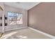 Spacious bedroom with large window and neutral walls at 120 Emerald Dunes Cir, Henderson, NV 89052