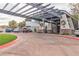 Community entrance featuring a pergola and ample parking at 120 Emerald Dunes Cir, Henderson, NV 89052