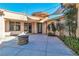 Private courtyard with fire pit and lush landscaping at 120 Emerald Dunes Cir, Henderson, NV 89052